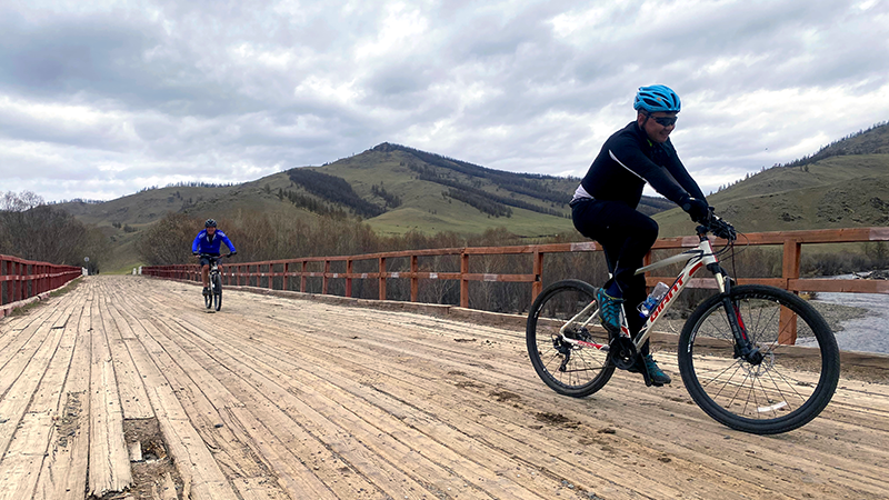 Cycling on a bridge in Khentii NP